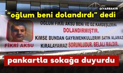 Oğlunun Kendisini Dolandırdığını İddia Eden Adam Pankartla Olayı Duyurdu