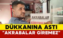 Dükkanına ’Akrabalar giremez’ pankartı astı