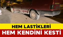 Hem park halindeki araçların lastiklerini hem de kendini kesti