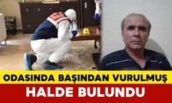 Odasında başından silahla vurulmuş halde ölü bulundu
