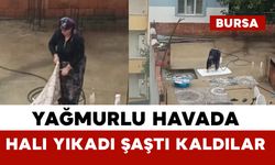 Yağmurlu havada çatıda halı yıkadı, görenler şaştı kaldı