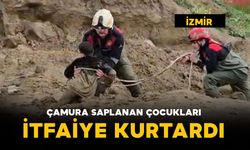 Çamura saplanan çocukları itfaiye kurtardı