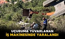 İş makinesi 60 metrelik uçuruma yuvarlandı operatör yaralı kurtuldu