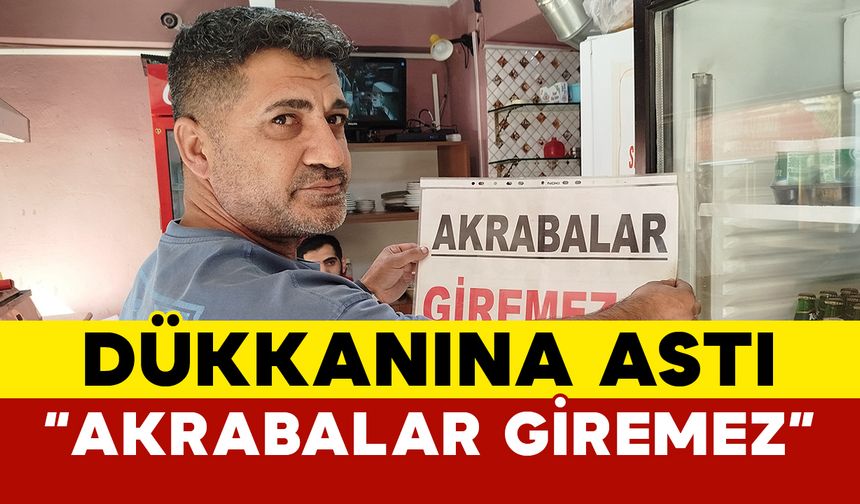 Dükkanına ’Akrabalar giremez’ pankartı astı