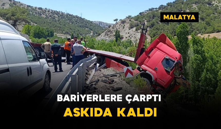 Bariyerlere çarparak askıda kaldı